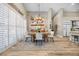 Bright dining room with a rustic wooden table and white chairs at 520 Summer Mesa Dr, Las Vegas, NV 89144