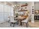 Rustic farmhouse dining room with a large wooden table and chandelier at 520 Summer Mesa Dr, Las Vegas, NV 89144