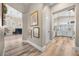 Bright hallway with hardwood floors and views into the living room and kitchen at 520 Summer Mesa Dr, Las Vegas, NV 89144