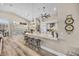 Open-concept kitchen boasts a spacious island with seating and stainless steel appliances at 520 Summer Mesa Dr, Las Vegas, NV 89144