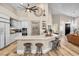 Bright kitchen boasts a large island with bar seating, white cabinetry, and stainless steel appliances at 520 Summer Mesa Dr, Las Vegas, NV 89144