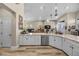 Kitchen with island, stainless steel dishwasher, and white shaker cabinets at 520 Summer Mesa Dr, Las Vegas, NV 89144