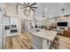 Open kitchen with large island, stainless steel appliances, and hardwood floors at 520 Summer Mesa Dr, Las Vegas, NV 89144