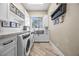 Spacious laundry room with a farmhouse sink and ample storage at 520 Summer Mesa Dr, Las Vegas, NV 89144