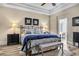 Main bedroom with king bed, ensuite bath access, and wood-look floors at 520 Summer Mesa Dr, Las Vegas, NV 89144