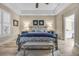 Main bedroom with king bed, ensuite bath access, and wood-look floors at 520 Summer Mesa Dr, Las Vegas, NV 89144