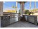 Outdoor kitchen with stainless steel appliances and stone accents at 520 Summer Mesa Dr, Las Vegas, NV 89144