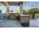 Outdoor kitchen with bar and grill area, perfect for alfresco dining and entertaining at 520 Summer Mesa Dr, Las Vegas, NV 89144