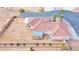 Single story house with tile roof, shed, and desert landscaping at 53 Flowering Desert Dr, Palm Gardens, NV 89039