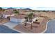 Single-story house with two-car garage and desert landscaping at 53 Flowering Desert Dr, Palm Gardens, NV 89039