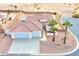 Single-story house with tile roof, two-car garage, and desert landscaping at 53 Flowering Desert Dr, Palm Gardens, NV 89039