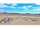 Aerial view of a desert community with several houses at 53 Flowering Desert Dr, Palm Gardens, NV 89039