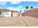 Backyard with storage shed and block wall at 53 Flowering Desert Dr, Palm Gardens, NV 89039