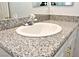Close-up of a bathroom sink with granite countertop at 53 Flowering Desert Dr, Palm Gardens, NV 89039