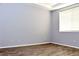 Bedroom with wood-look flooring and window blinds at 53 Flowering Desert Dr, Palm Gardens, NV 89039