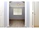 Bright bedroom with wood-look floors and ceiling fan at 53 Flowering Desert Dr, Palm Gardens, NV 89039