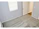 Bright bedroom with gray carpet and an open door at 53 Flowering Desert Dr, Palm Gardens, NV 89039