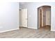 Bedroom with wood-look floors and access to closets at 53 Flowering Desert Dr, Palm Gardens, NV 89039