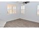 Bright dining area with wood-look floors and large windows at 53 Flowering Desert Dr, Palm Gardens, NV 89039