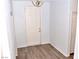 Entryway with wood-look floors and a white door at 53 Flowering Desert Dr, Palm Gardens, NV 89039
