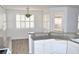 Kitchen with granite countertops, white cabinets, and a breakfast bar at 53 Flowering Desert Dr, Palm Gardens, NV 89039