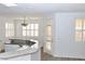 Kitchen with granite countertops, white cabinets, and a breakfast bar at 53 Flowering Desert Dr, Palm Gardens, NV 89039