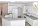 Spacious kitchen with granite countertops and white cabinets at 53 Flowering Desert Dr, Palm Gardens, NV 89039