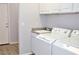 Laundry room with washer, dryer, and cabinets at 53 Flowering Desert Dr, Palm Gardens, NV 89039