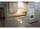 This kitchen features granite counters, modern appliances, and plenty of cabinet space at 5524 Big Sky Ln, Las Vegas, NV 89149