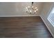 Bright and airy living room featuring hardwood floors and a chandelier at 5524 Big Sky Ln, Las Vegas, NV 89149