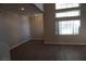 Bright and airy living room with large windows and hardwood floors at 5524 Big Sky Ln, Las Vegas, NV 89149