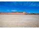 Wide open backyard landscape featuring snow capped mountains and bright blue sunny skies at 5841 Genoa Ave, Pahrump, NV 89060