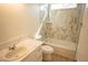 Bathroom features marble tiled shower and backsplash, bathtub, quartz countertops, wood-look flooring and vanity at 5841 Genoa Ave, Pahrump, NV 89060