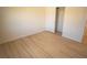 Bedroom featuring wood-look flooring and a closet with a sliding door at 5841 Genoa Ave, Pahrump, NV 89060