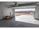 A spacious open garage with an automatic door, offering expansive views of the surrounding landscape at 5841 Genoa Ave, Pahrump, NV 89060
