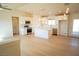 Open-concept kitchen featuring white cabinets, stainless steel appliances, and a center island at 5841 Genoa Ave, Pahrump, NV 89060