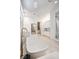 Elegant bathroom boasting a freestanding tub and walk-in shower at 65 Garibaldi Way, Henderson, NV 89011