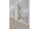 Spa-like bathroom with large walk-in shower and marble tile at 65 Garibaldi Way, Henderson, NV 89011