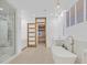 Luxurious bathroom with soaking tub, walk-in shower, and modern fixtures at 65 Garibaldi Way, Henderson, NV 89011