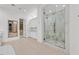 Spa-like bathroom with a large walk-in shower and marble tile at 65 Garibaldi Way, Henderson, NV 89011
