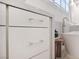 Modern bathroom with white cabinets and marble vanity top at 65 Garibaldi Way, Henderson, NV 89011