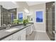 Modern bathroom with dual vanities and a large shower at 65 Garibaldi Way, Henderson, NV 89011