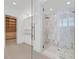 Spa-like bathroom with large walk-in shower and marble tile at 65 Garibaldi Way, Henderson, NV 89011