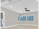 Bright bedroom featuring hardwood floors and large windows with shutters at 65 Garibaldi Way, Henderson, NV 89011