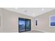 Bedroom with sliding glass doors leading to a private balcony at 65 Garibaldi Way, Henderson, NV 89011