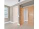 Bright bedroom with light walls, wood flooring, and access to hallway at 65 Garibaldi Way, Henderson, NV 89011