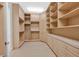 Large walk-in closet with ample shelving and drawers at 65 Garibaldi Way, Henderson, NV 89011