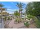 Paved path meanders through desert landscaping toward lake at 65 Garibaldi Way, Henderson, NV 89011