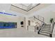 Open great room with high ceilings, fireplace, and wet bar at 65 Garibaldi Way, Henderson, NV 89011