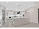 Modern kitchen with large island and stainless steel appliances at 65 Garibaldi Way, Henderson, NV 89011